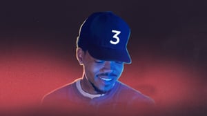 Image of Chance the Rapper wearing a blue hat with the number 3.