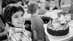 Children-at-birthday-party-with-cake_grayscale-full_q085_1920x1080