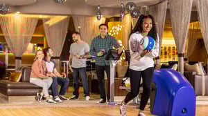 Photo of friends bowling and relaxing at Kingpin VIP Lanes & Lounge at GSR.