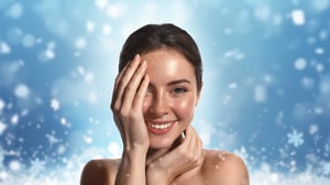 Young woman at the spa with wintery snowflake background.