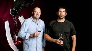 Image of Charlie Palmer and Clay Mauritson with a background of wine pouring into a glass.