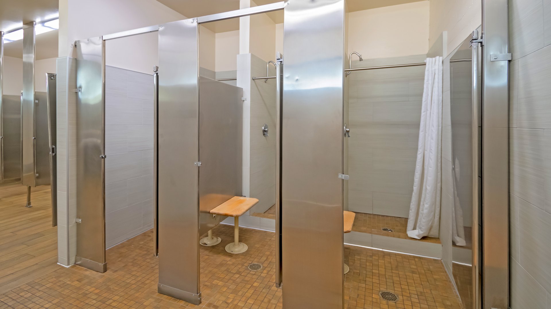 RV-Park-Washroom-view-of-shower-stalls_q085_1920x1080
